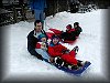 Eric, Christopher and Tyler sledding at a local golf course