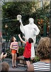 Tyler gets taken off-guard as a Living Statue steals his hat in Epcot