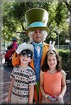 Kelsey and Tyler meet the Mad Hatter in the Magic Kingdom